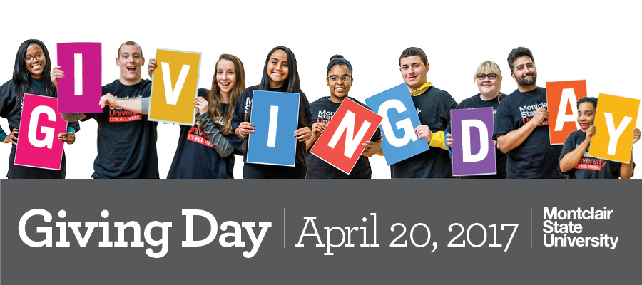 Students holding giving day sign for April 20, 2017